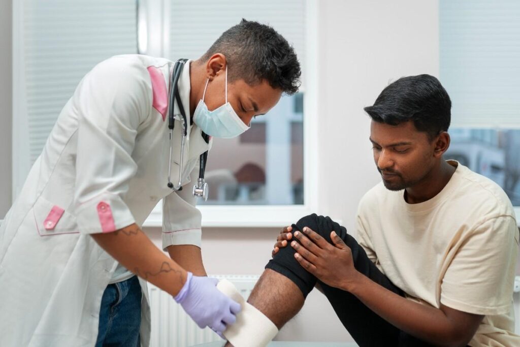 Orthopedic specialist in Mangalore examining a patient with knee and joint pain.